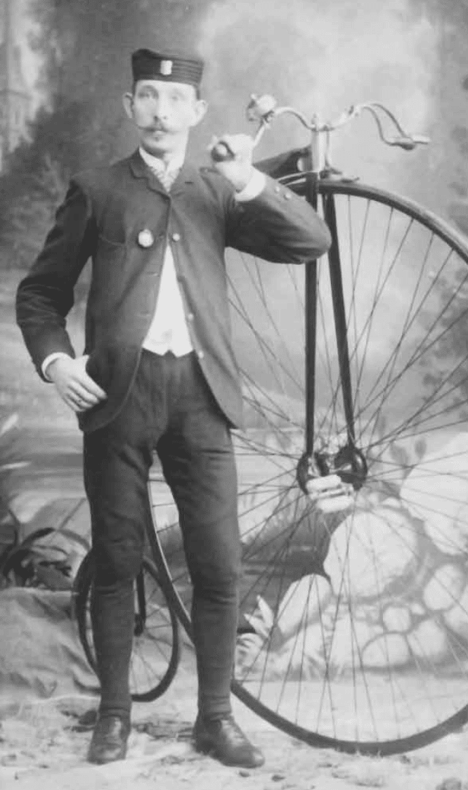Photo of Fridolin Schimmel with his Penny Farthing bicycle in Faribault Minnesota